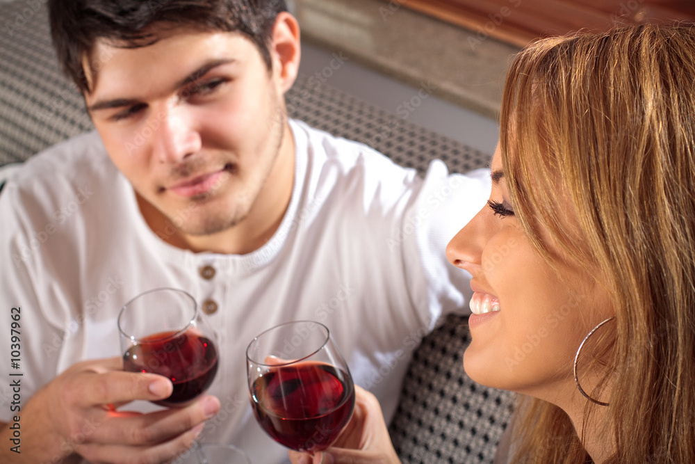 Happy young couple drinking wine Happy young couple drinking wine