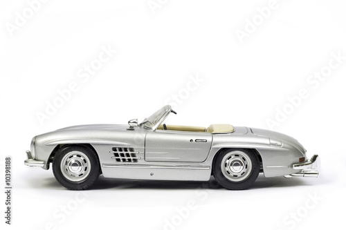 Classical sport car model toy. Side view. © titelio