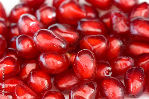 macro of ripe seeds pomegranate isolated