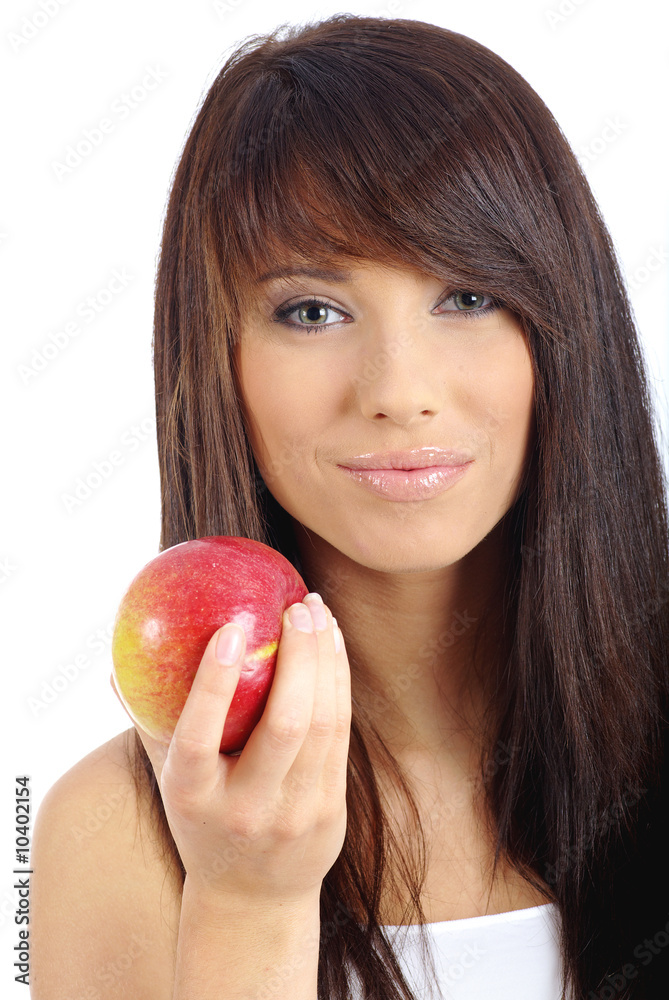 Beautiful young woman eating a red apple. Isolated over white Beautiful young woman eating a red apple. Isolated over white