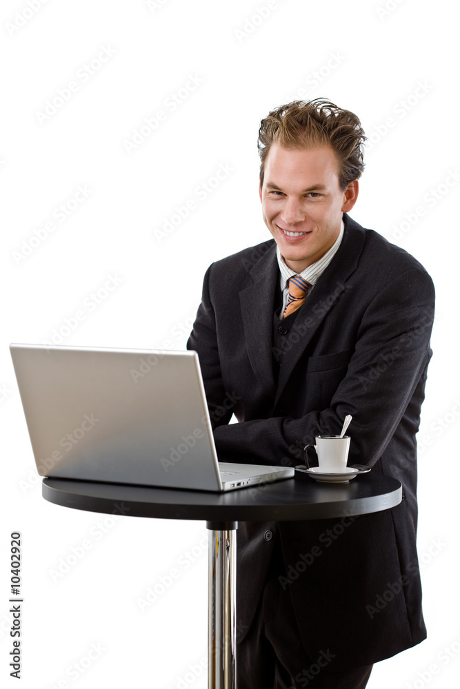 Businessman working on computer at coffee table, Businessman working on computer at coffee table,