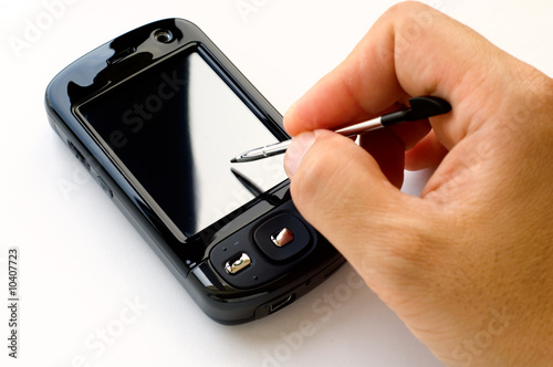 Man hand holding pda and stylus, isolated over white