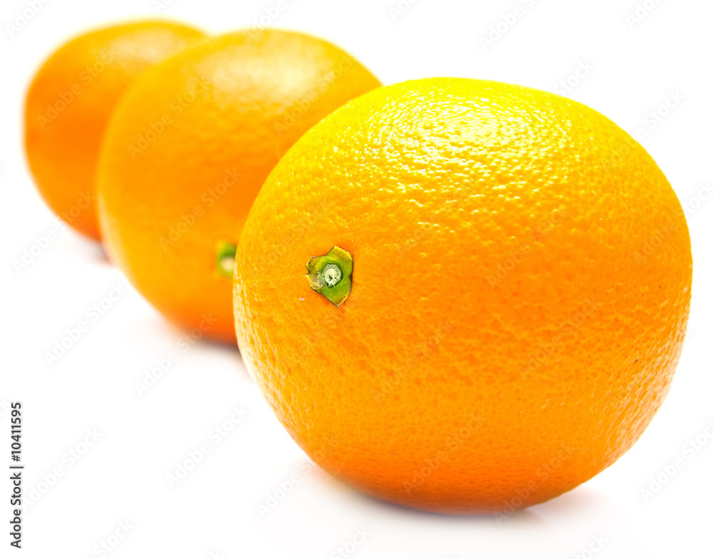 The ripe whole oranges with real reflexion on white. Isolation The ripe whole oranges with real reflexion on white. Isolation