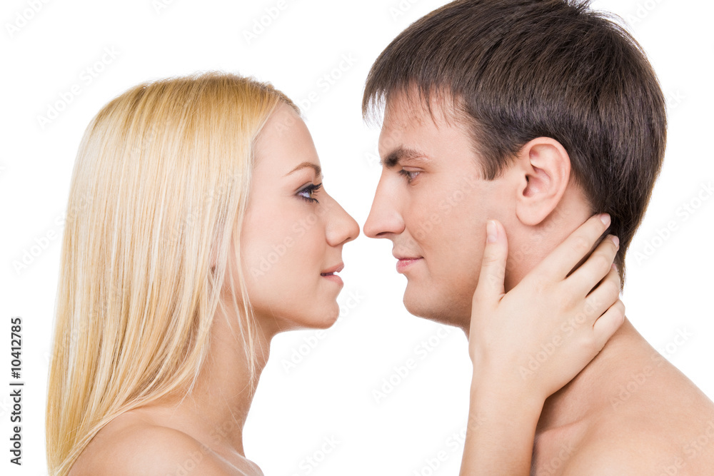 Profiles of two lovers before kissing each other Profiles of two lovers before kissing each other