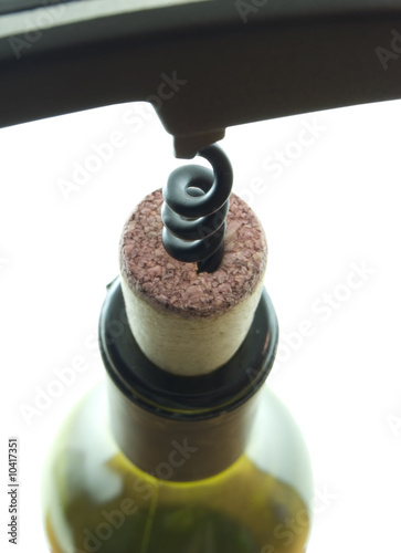 Closeup of a corkscrew opening a bottle of wine