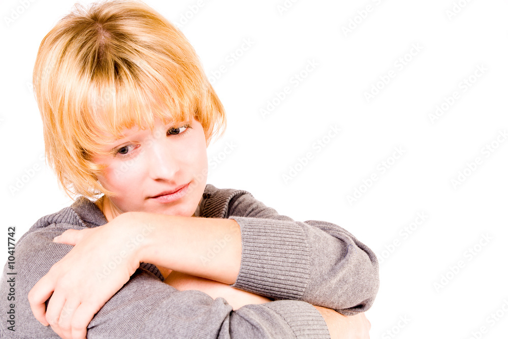 Studio portrait of a red haired girl looking sad Studio portrait of a red haired girl looking sad