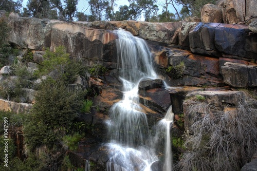 Beautiful waterfall on small forest river in the Canberra region photo