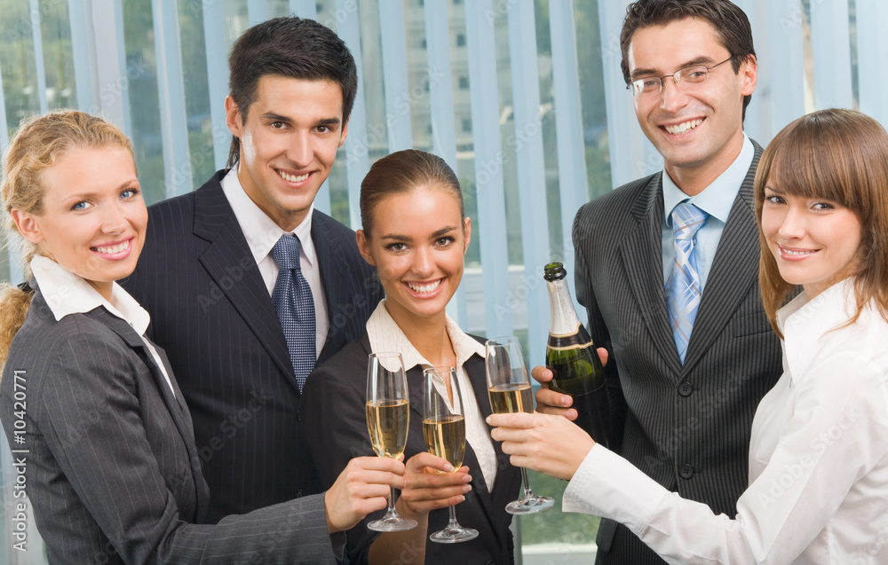 Happy business team celebrating with champagne at office Happy business team celebrating with champagne at office