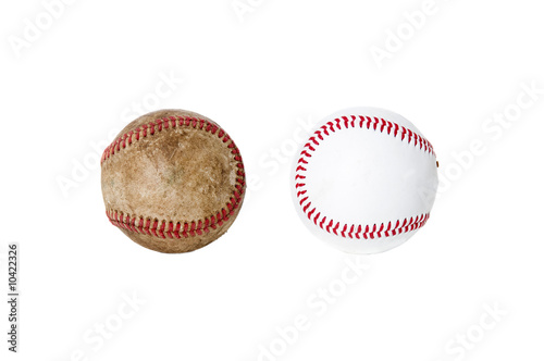 Photography A worn baseball next to a new one. isolated on white