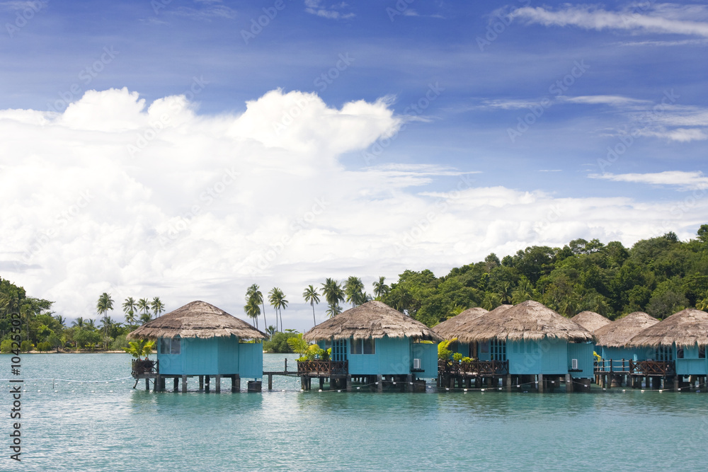 blue cabins built on pillars in water, koh chang, thailand