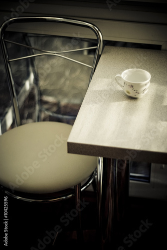 a Dining table with a cup