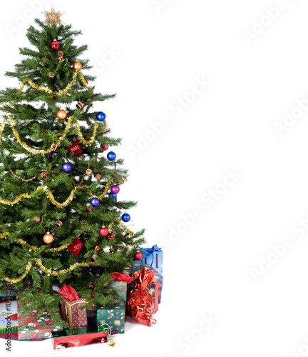 An isolated Christmas tree ready for Santa.