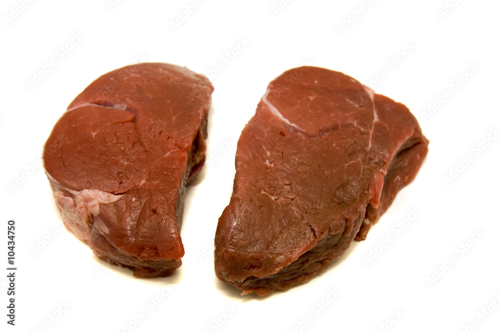 Two fillet mignon steaks on a white background Two fillet mignon steaks on a white background