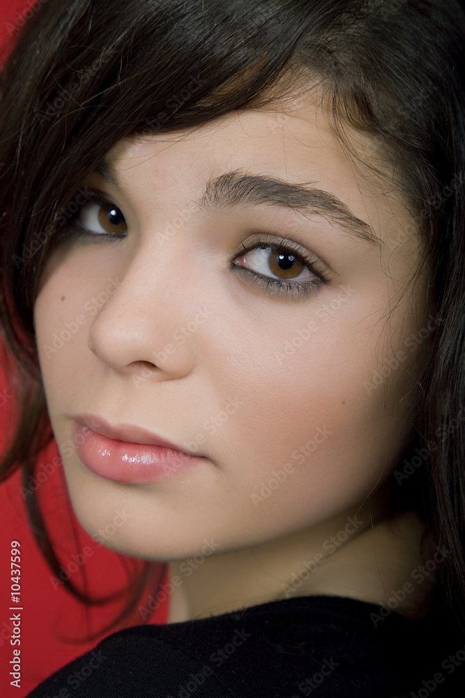 young woman portrait isolated on red background young woman portrait isolated on red background