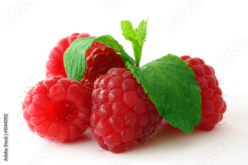 Fresh, ripe raspberries on white
