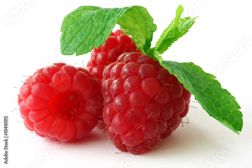 Fresh, ripe raspberries on white