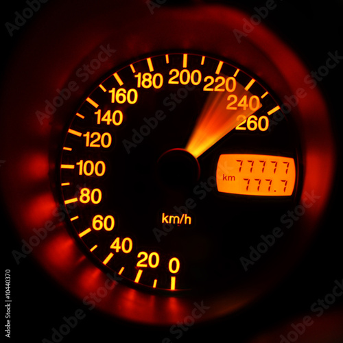 Accelerating sport-car speedometer closeup