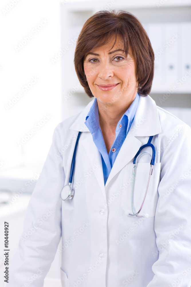 Portrait of senior female doctor working at office. Portrait of senior female doctor working at office.