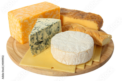 Various types of cheese on wooden platter