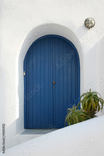 Picturesque blue house door on Santorini Island, Greece.