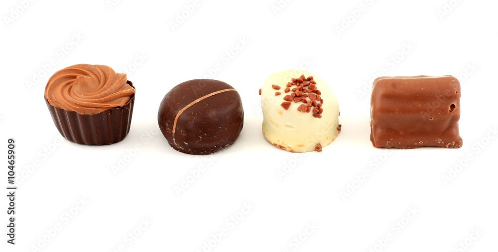 Exquisite chocolate candies, white background Exquisite chocolate candies, white background