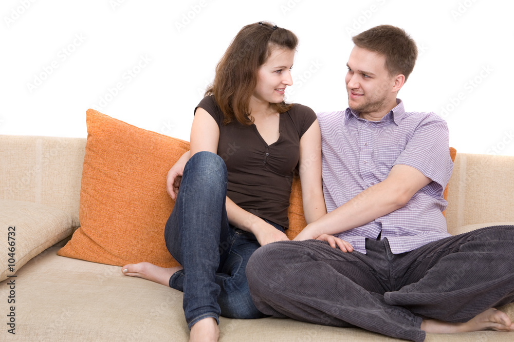 casual couple sitting on sofa