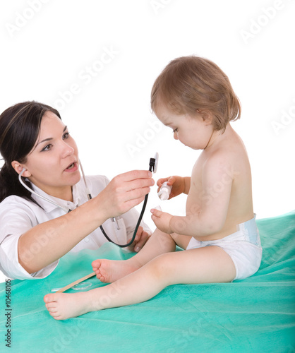 Young pediatrician with baby girl  over white background