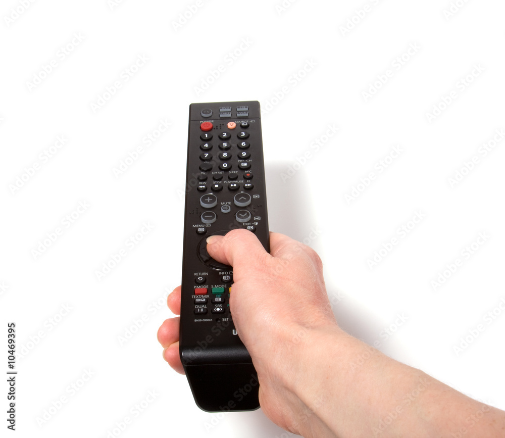 Hand holding tv remote control isolated on white background Hand holding tv remote control isolated on white background