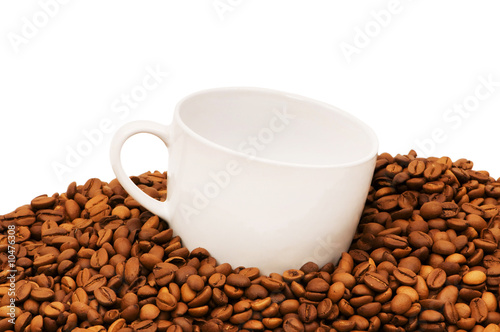 Cup and coffee beans isolated on the white.