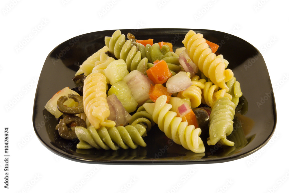 multi-colored pasta salad with onions, olives, and tomatoes multi-colored pasta salad with onions, olives, and tomatoes