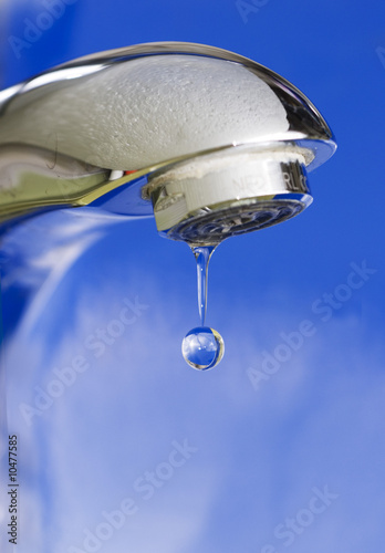close-up shot of leaking faucet