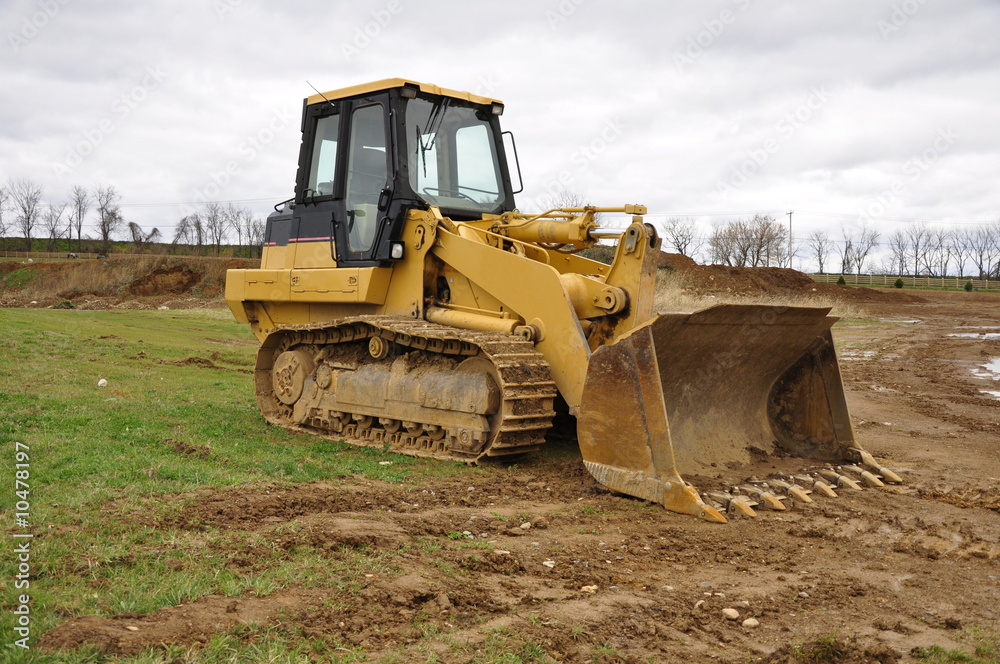 yellow bulldozer at a construction site yellow bulldozer at a construction site