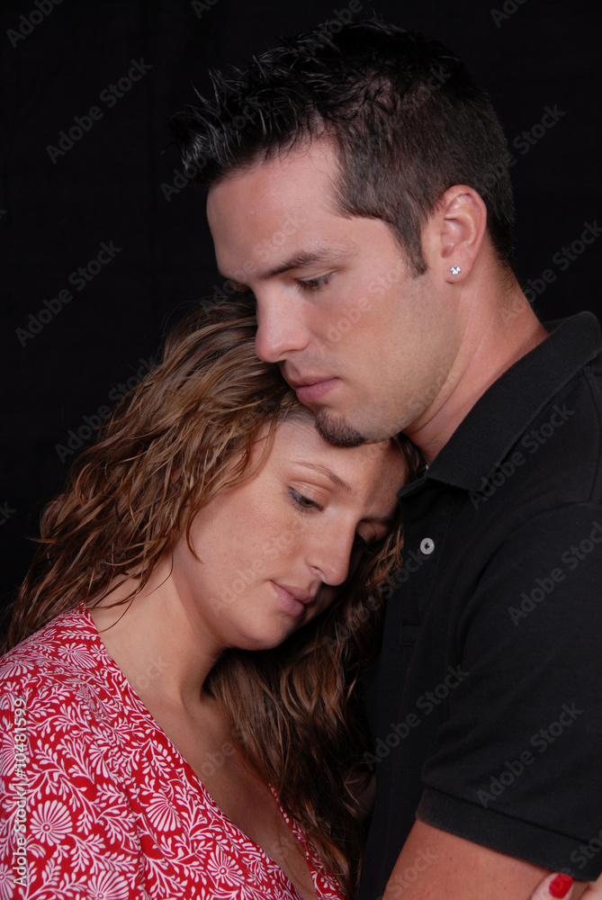 Couple holding with each other with care head on chest.. Couple holding with each other with care head on chest..