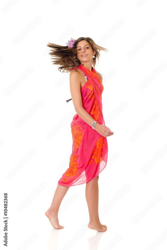 Attractive young woman in bikini wrapped in sarong. Attractive young woman in bikini wrapped in sarong.