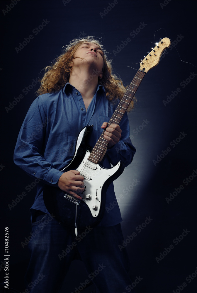 Man with electric guitar playing rock music Man with electric guitar playing rock music