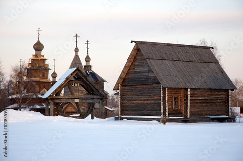 old russian wooden village with church, building and well