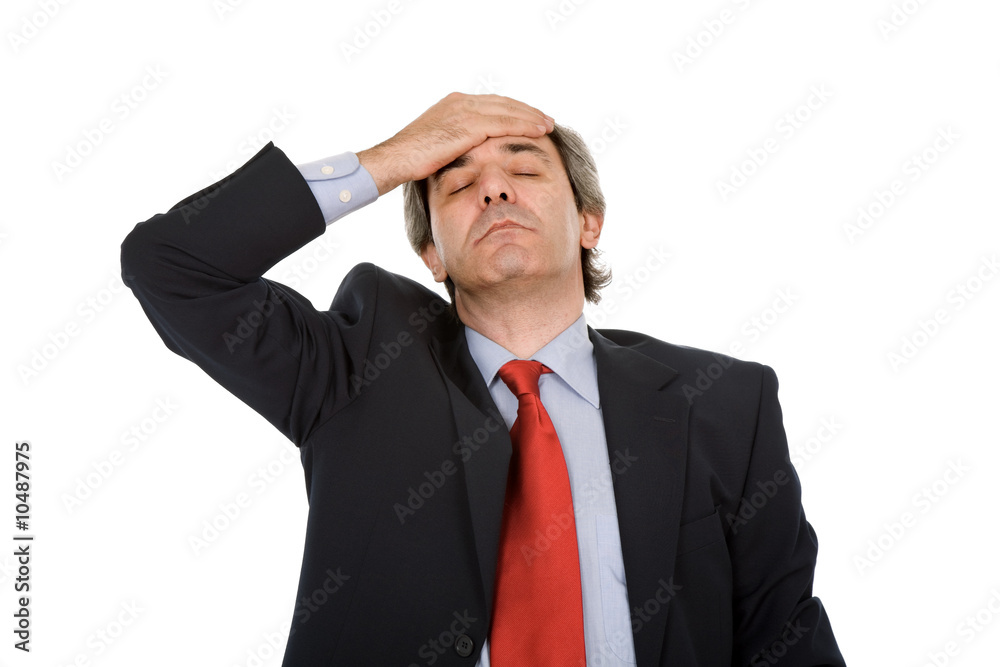 Businessman in a suit gestures with a headache Businessman in a suit gestures with a headache