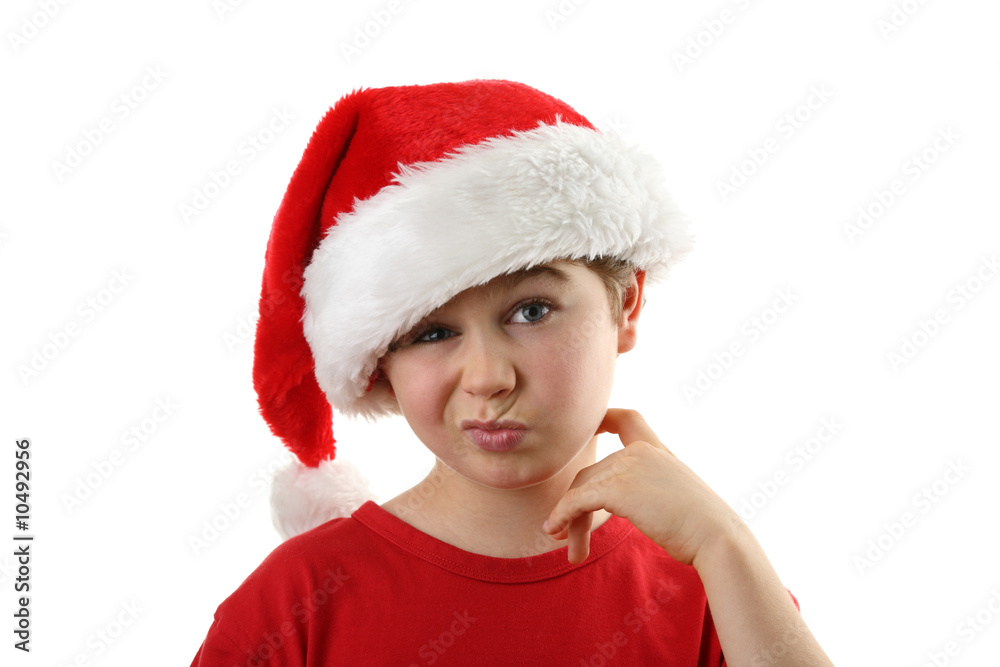 Christmas time - boy with Santa's hat isolated on white Christmas time - boy with Santa's hat isolated on white