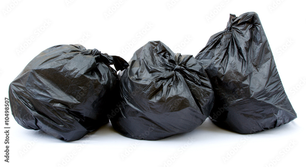 Three black garbage bags isolated on a white background