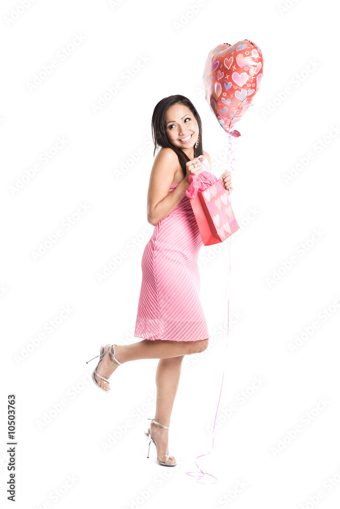 A beautiful asian woman carrying balloon and valentine gift. A beautiful asian woman carrying balloon and valentine gift.