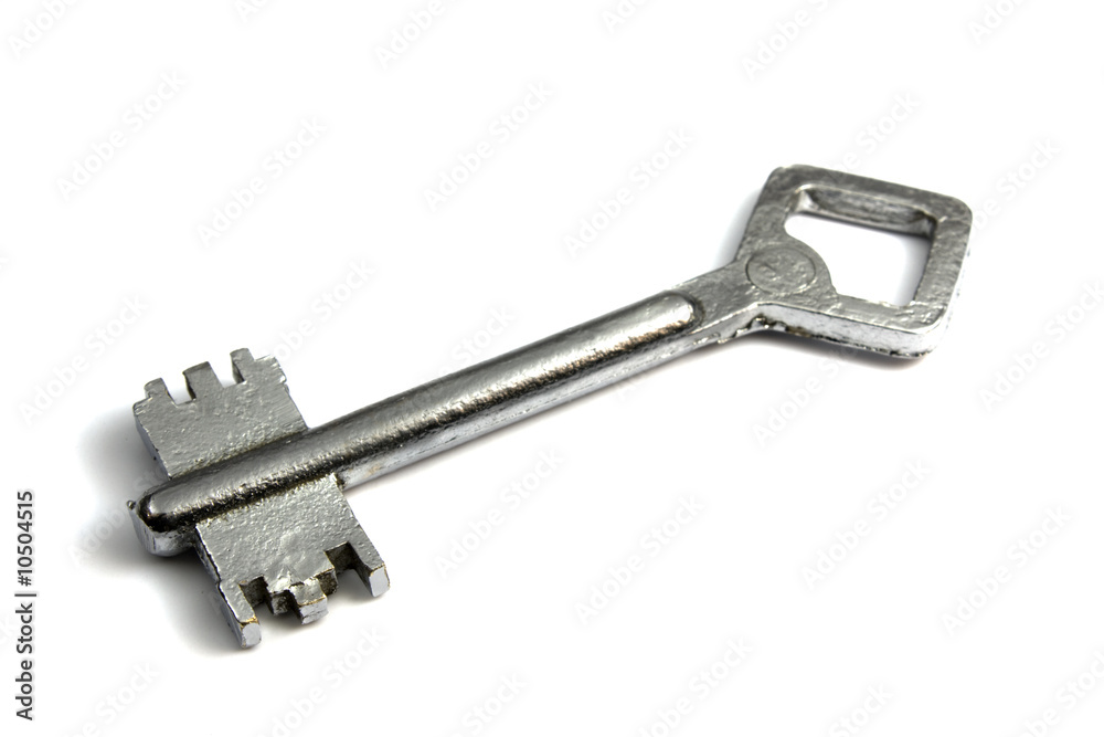 Old-fashioned chromeplated key on a white background Old-fashioned chromeplated key on a white background