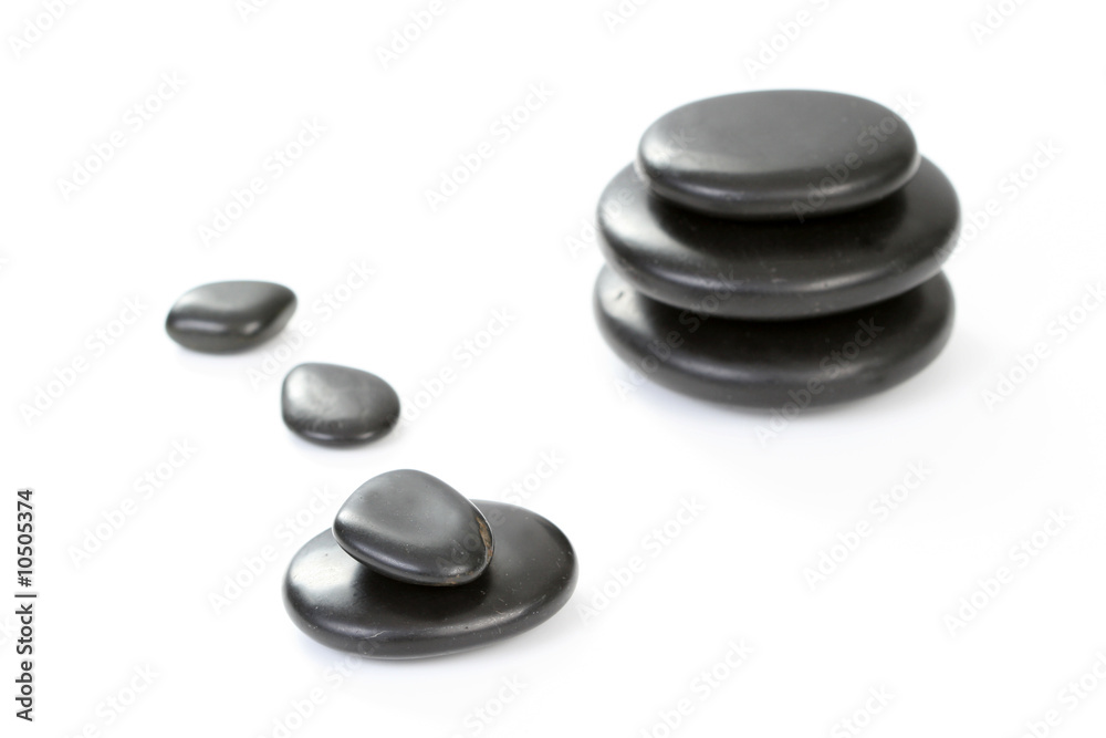 black pebbles isolated on white - health and beauty black pebbles isolated on white - health and beauty