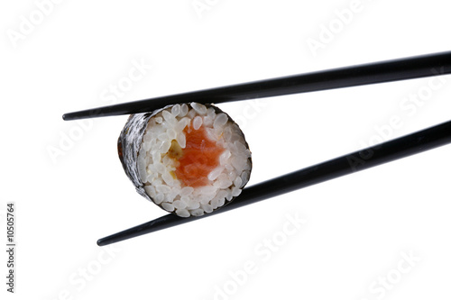 Stock Photo: roll with chopsticks isolated on white