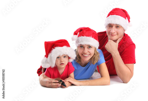 Happy family in Christmas hats 3