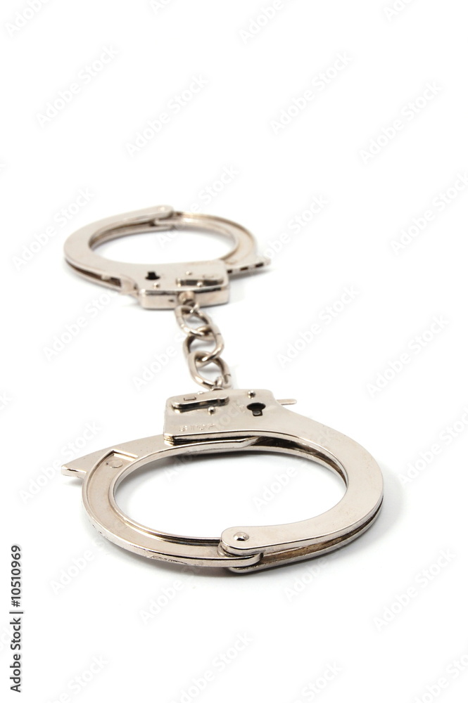 police handcuffs isolated on a white background police handcuffs isolated on a white background