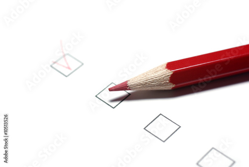 Obraz na płótnie Red pencil and checkboxes isolated on white background. w salonie