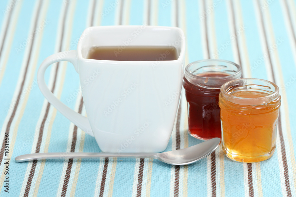 cup of delicious tea with sweet confiture cup of delicious tea with sweet confiture