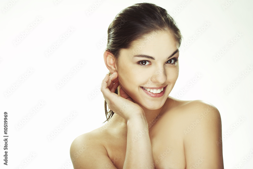 Fototapeta premium A happy young woman with facial expression on white background