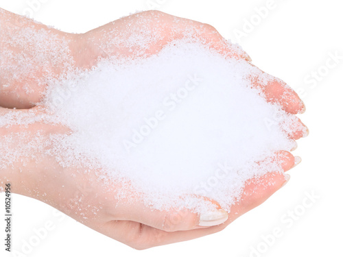 Photo of the hands with snow against the white background