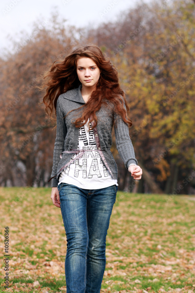 Beautiful young woman in autumnal park Beautiful young woman in autumnal park